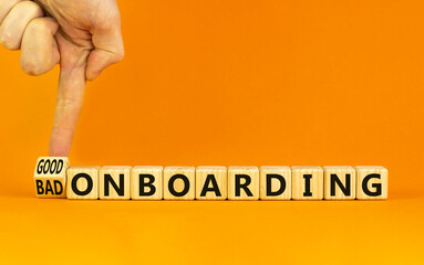 Good or bad onboarding symbol. Businessman turns a cube and changes words 'bad onboarding' to 'good...