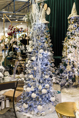 The holidays location with blue white long Christmas tree