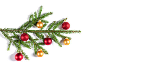 Christmas background with fir branches, gold and red balls on white background. Banner. View from above. Space for text.