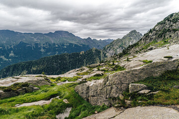 Fototapeta na wymiar View of a high alpine landscape of Bergell (Bregaglia), Switzerland and Italy. Summer alpine mountain landscape.