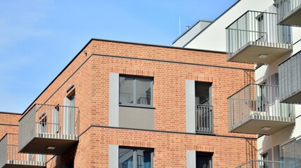 Fototapeta na wymiar Modern apartment building. Modern urban architecture and details of building facade. Sunlight.