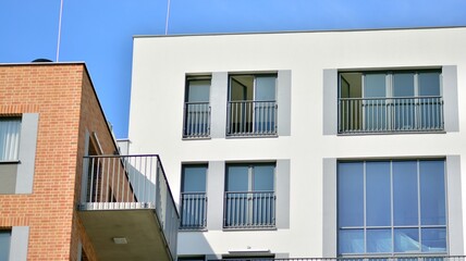 Modern apartment building. Modern urban architecture and details of building facade. Sunlight.