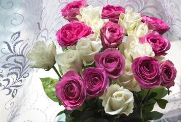 Close-up of bouquet of white and pink roses