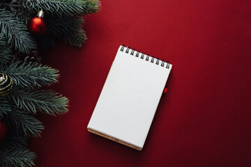 New year christmas flat lay with empty notebook copy space, on red background. Mock up