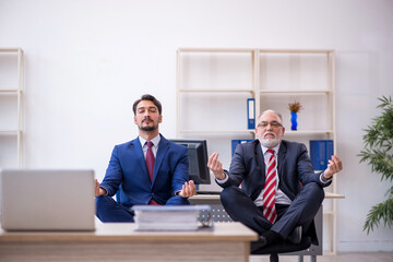 Two male colleagues working in the office