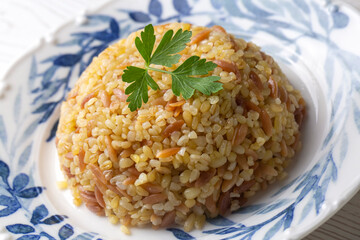 Traditional delicious Turkish food, bulgur pilaf with vermicelli (Turkish name; arpa sehriyeli bulgur pilavi)