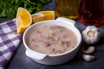 Traditional delicious Turkish food, Turkish traditional tripe soup; iskembe corbasi and offal soup, Turkish Meat Soup Kelle Paca (Turkish name; Kelle paca corbasi)