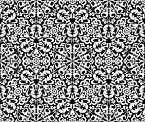 Ornate white pattern on a black background. Demaski seamless elegant pattern. Lace pattern. Black and white color. Vector graphic vintage pattern. For fabric, tile, wallpaper or packaging. 