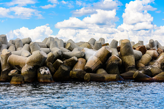 Breakwater made of the tetrapods in sea. Coastal defence barrier