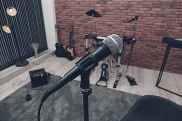 Musical instruments in studio, focus on microphone