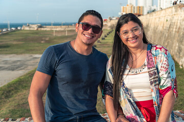 Obraz premium Portrait of Couple looking at camera in the open air