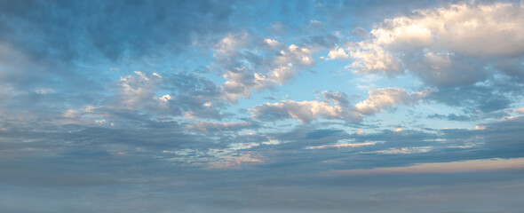 Clouds in the sky all the way to horizon line taken early evening just before sunset 