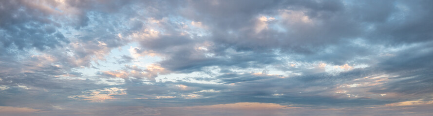 Clouds in the sky all the way to horizon line taken early evening just before sunset 