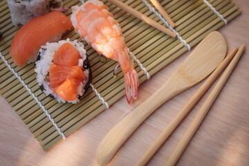 The composition of sushi and natural light. Appetizing colors. Shrimp