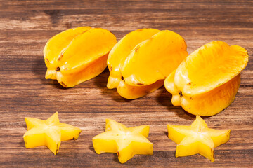 Averrhoa Carambolo - Star Fruit Or Carambola; Photo On Wooden Background