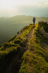 Hiker Man, backpacker hiking in Italian dolomites during sunset, Secede.