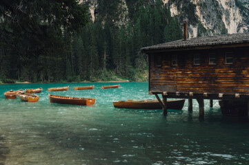 Lago di Braies (Braies lake, Pragser wildsee) Lake and wooden cabin in South Tyrol, Italy ; moody...