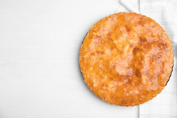 Delicious pie with meat on white wooden table, flat lay. Space for text