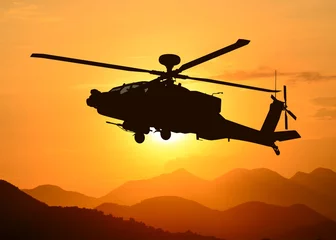 Fotobehang American attack helicopter in flight © filmbildfabrik