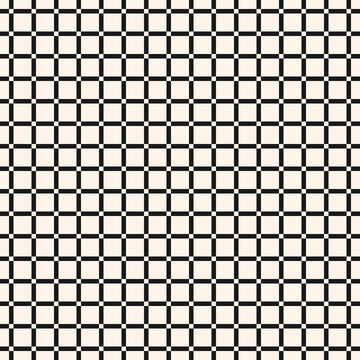 A lattice of intersecting lines. Abstract seamless checkered pattern with formed squares in black and white colors. The ornament is used on plaid, business cards, packaging, textiles