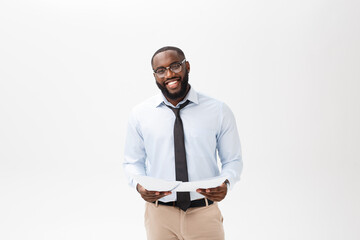 Happy African American man holding documaent paper over isolated white background with a surprise and shock face expression