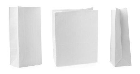 Set with paper bags on white background