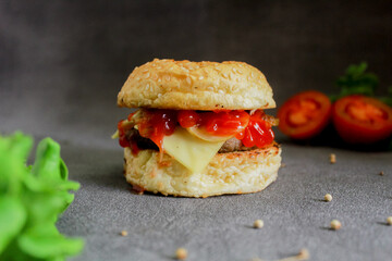 Burger with tomato sauce and cheese. This burger photo is suitable for menu and advertising purposes