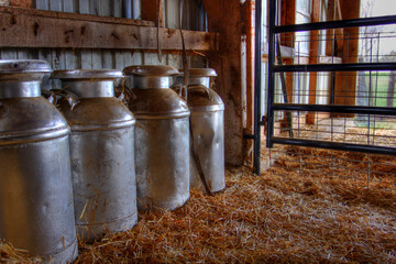 Vintage milk can in a barn