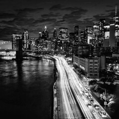 city at night traffic New York views cars buildings skyscrapers bridge black white 