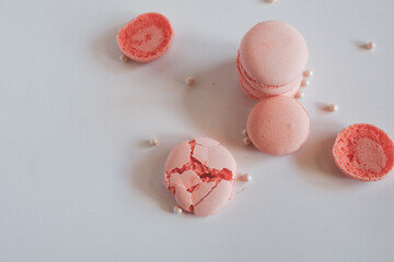 Pink french macaroons on white background. Sweet background. Copy space vintage tone
