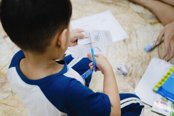 Childhood are learning to use scissors to cut paper.