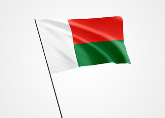Madagascar flag flying high in the white isolated background. June 26 Madagascar independence day World national flag collection. Nation flag 3D illustration