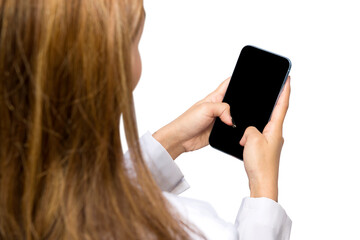 Rear view of Asian female doctor using mobile phone
