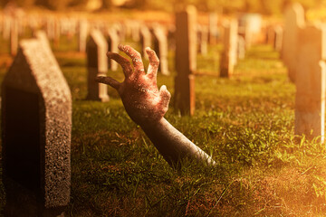 Zombie hand with blood and wound raised