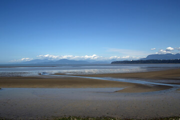 A view of an ocean bay with mountains