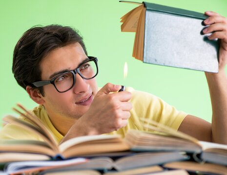 Student with too many books to read before exam