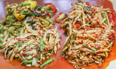 Select focus green papaya salad,(Som tum) is Thai street food with the taste of hot and spicy
