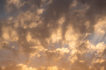 Blue sky with clouds at sunrise. Morning sky background