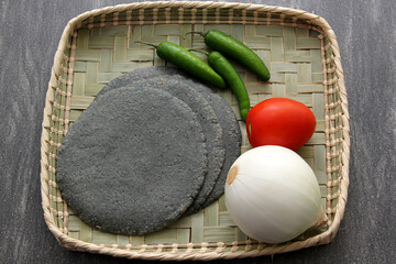 Fresh, delicious, freshly made blue dough tortillas along with a variety of fresh vegetables:...