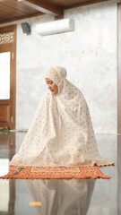 Asian Muslim women end prayers with greetings in the mosque