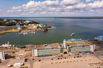 Cityscape of Cheboksary with view of river port and Holy Trinity Orthodox Monastery.