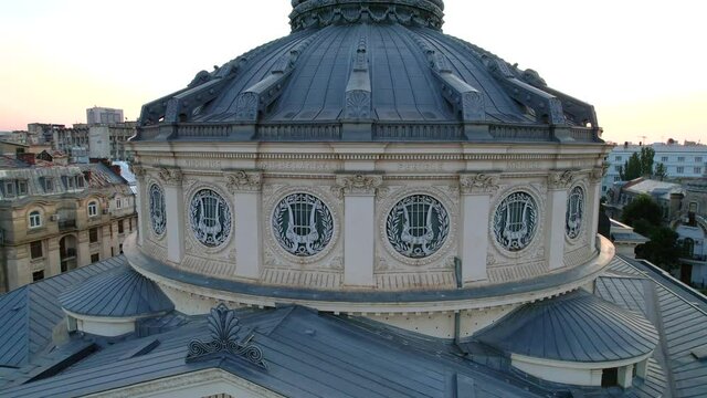 Bucharest, Romania, July 12th, 2021. Low aerial shot of the dome of the The Romanian Atheneum, a landmark concert hall in Bucharest, Romania.