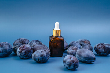 Essence for the health of the skin on the background of plums. Healthy lifestyle. Serum for men and women.
