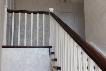 wooden staircase with brown treads and white risers