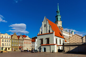 Fototapeta premium View of historic building of Weighing house and Town Hall in centre of Poznan Market Square in sunny spring day, Poland