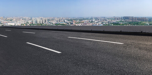 Fototapeta premium Empty asphalt road and city skyline and building landscape, China.