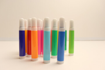 Colorful felt-tip pens on white background for school banner design