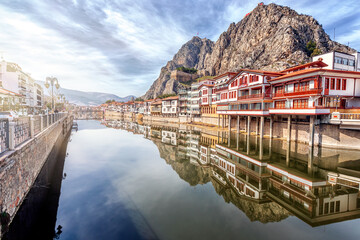 Landscape of historical houses, clock tower and Green River (Turkish: Yesilirmak) of Amasya city....