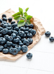 Blueberries on white tile  background