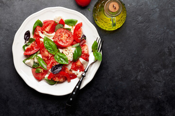 Caprese salad with fresh tomatoes, garden basil and mozzarella cheese
